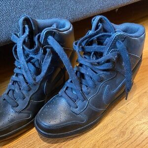 Nike high top sneakers practically new or leather women’s 7 1/2 only wore twice